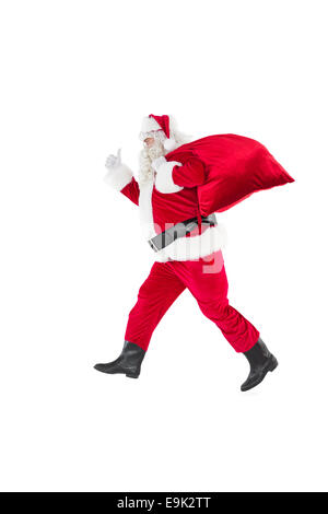 Positive santa with his sack and thumbs up Stock Photo - Alamy