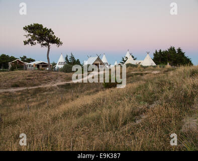 luxury campsite in coastal dunes viewed at dusk Stock Photo
