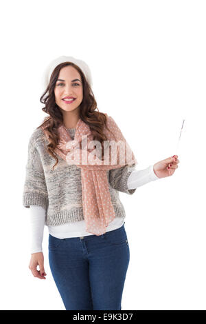 Brunette in winter clothes holding Stock Photo