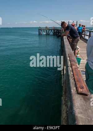 man fishing with a carrelet lift net from a pier Noirmoutier-en-l'Île on the island noirmoutier Stock Photo