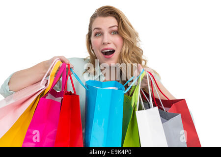 Overwhelmed young woman with shopping bags Stock Photo