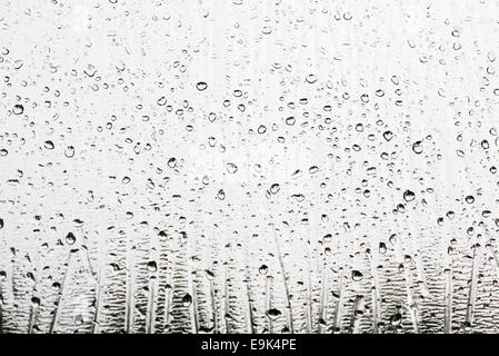 droplets of rain on frosted glass clear Stock Photo