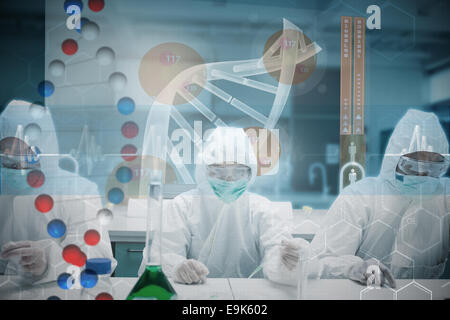 Composite image of scientists working in the lab with futuristic interface Stock Photo