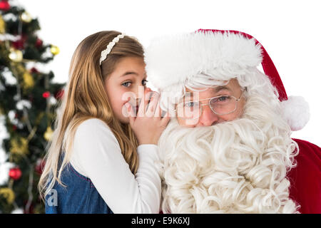 Little girl teling santa claus a secret Stock Photo
