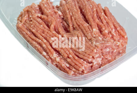 Minced Pork in plastic container on white background. Stock Photo