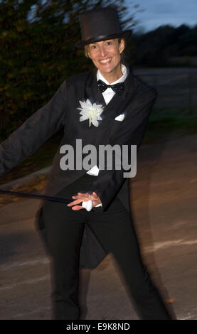 Attractive woman in top hat and tails costume at Liphook Carnival, 25 October 2014, Liphook, Hampshire, UK. Stock Photo