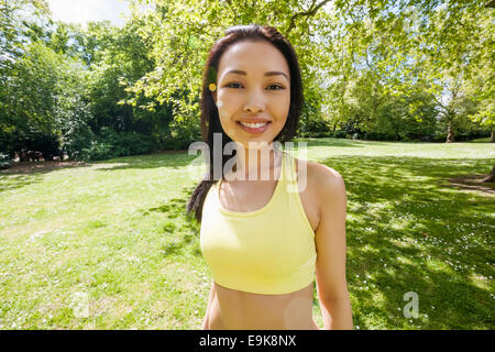 Portrait of confident fit woman at park Stock Photo