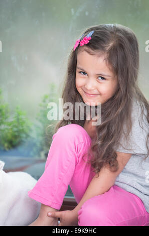 Portrait of cute little girl relaxing at home Stock Photo