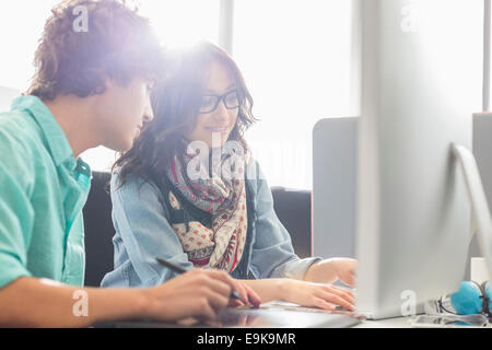 Creative business colleagues using desktop computer in office Stock Photo
