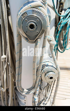 Ropes wound around winches on sailboat Stock Photo