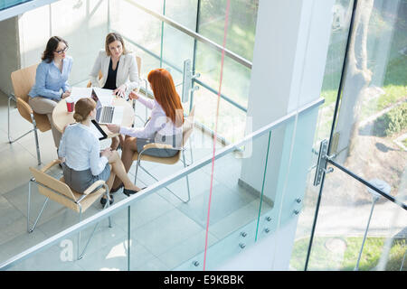 High angle view of businesswomen discussing at table in office Stock Photo