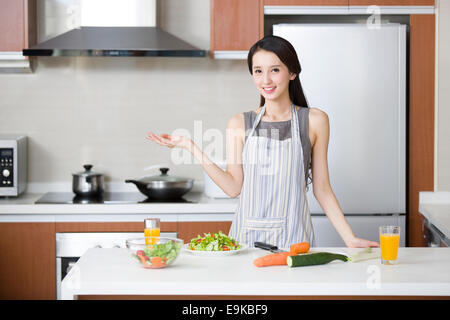 Young woman cooking in the kitchen Stock Photo