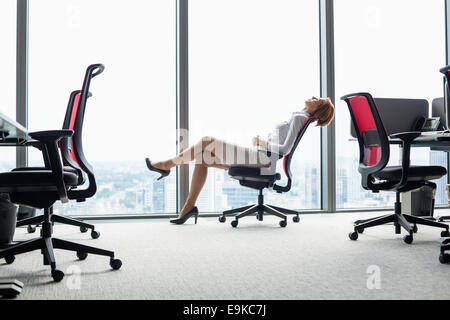 Full length back side view smiling blond mother on yoga mat with cute  playful little preschool daughter do various exercises. Happy mommy  practicing y Stock Photo - Alamy