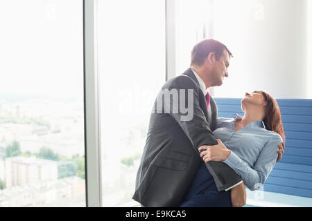 Loving business couple dancing in office Stock Photo