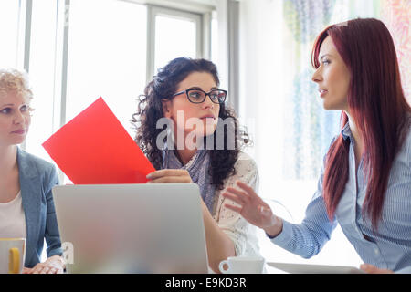 Creative businesswomen discussing in meeting at office Stock Photo