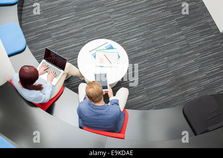 High angle view of business people using technologies in office Stock Photo