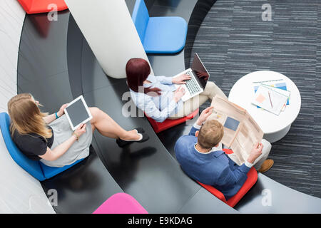 High angle view of business people sitting in office lobby Stock Photo