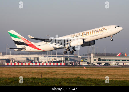 Emirates Airbus A330-200 climbs away from runway 05L at Manchester Airport. Stock Photo