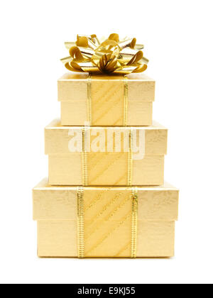 Stack of gold Christmas gifts isolated on white Stock Photo