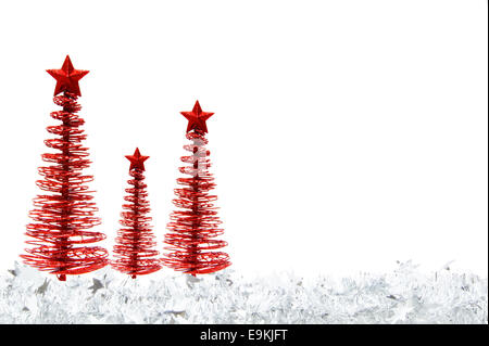 Christmas border of red trees and silver garland over white Stock Photo