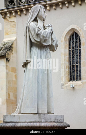 Statue of Bernadette Soubirous in the Espace Bernadette Soubirous at Nevers, Burgundy, France Stock Photo