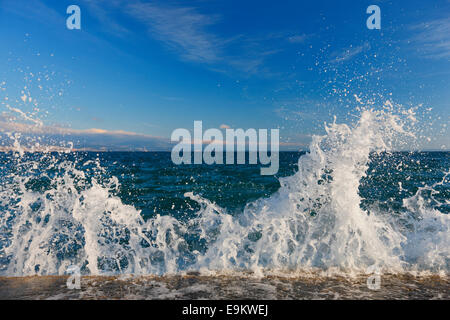 Sea waves splashing the rock on the beach Stock Photo