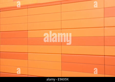 Vivid orange pattern block wall Stock Photo