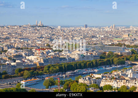 Birds eye view from Eiffel Tower on Paris city, France with Sacre Coeur cathedral on the horizon Stock Photo