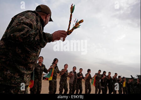 Fighters of the Kurdish People's Protection Units YPG mark the V-sign ...