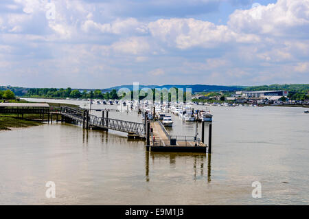 Pleasure boats moored to floating docks accessed by protected catwalks in the calm waters of the River Medway, Rochester Stock Photo