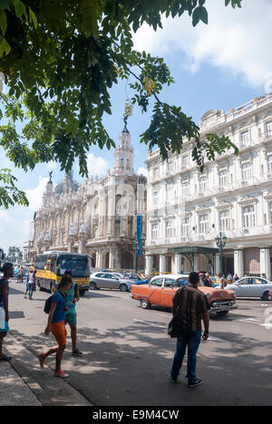 Pedestrians attempt to cross a busy street across from the Hotel Inglaterra on Paseo de Marti Paseo del Prado in Havana Cuba Stock Photo