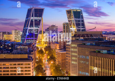 Madrid, Spain financial district skyline at twilight viewed towards the Gate of Europe Plaza. Stock Photo