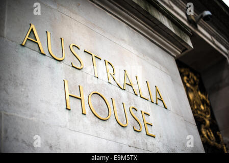 Australia House London | LONDON — Gilded lettering spelling "Australia House" is set into the Portland stone base of the building's entrance pavilion on the Strand, a security camera mounted discreetly above. The inscription marks the headquarters of Australia's High Commission, opened by King George V in 1918 as the Commonwealth's first permanent diplomatic post abroad. Stock Photo