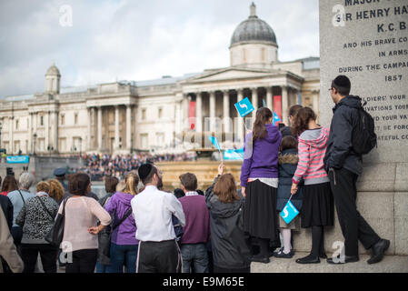 LONDON, United Kingdom — Crowds gather in Trafalgar Square to watch a parade of the Sea Cadets, with the iconic National Gallery standing prominently in the background. This event showcases the blend of British naval tradition and London's rich cultural heritage in one of the city's most famous public spaces. Stock Photo