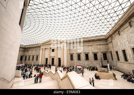 LONDON, United Kingdom — The Queen Elizabeth II Great Court at the British Museum. This expansive public square, designed by Foster and Partners, features a distinctive glass and steel roof made of 3,312 unique panes, and surrounds the historic Reading Room. Opened in 2000, it is the largest covered public square in Europe, serving as a central hub for visitors. Stock Photo