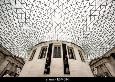 LONDON, United Kingdom — The Queen Elizabeth II Great Court at the British Museum. This expansive public square, designed by Foster and Partners, features a distinctive glass and steel roof made of 3,312 unique panes, and surrounds the historic Reading Room. Opened in 2000, it is the largest covered public square in Europe, serving as a central hub for visitors. Stock Photo