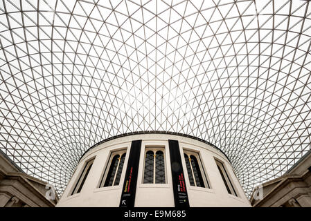 LONDON, UK - The distinctive Great Court at the British Museum in London. Designed by Foster and Partners, its formal name is the Queen Elizabeth II Great Court. It converted the Museum's inner courtyard into the largest covered public square in Europe. It encloses two acres, with the round reading room in the center. The British Museum in downtown London us dedicated to human history and culture and has about 8 million works in its permanent collection. London, United Kingdom. The British Museum in London houses a vast collection of world art and artifacts, reflecting human history, culture,  Stock Photo