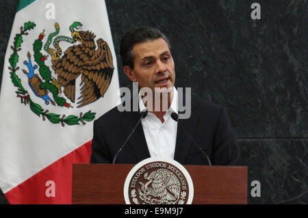 Mexico City, Mexico. 29th October, 2014. Mexican President Enrique Pena Nieto addresses a press conference after meeting with relatives of 43 missing students of the Normal Rural School of Ayotzinapa. Pena Nieto said that the relatives of the 43 missing students delivered him a 10-point list of demands, which his government has agreed to strengthen the localization efforts with a renewed search plan, the creation of a mixed commission of monitoring and information, besides strengthening the normal rural schools of the country. © Xinhua/Alamy Live News Stock Photo