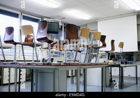 Several chairs on tables in a room Stock Photo