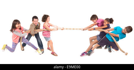 Group of children in a rope-pulling contest Stock Photo