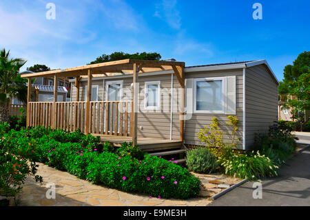 a nice mobile home with a wooden veranda in a campsite Stock Photo