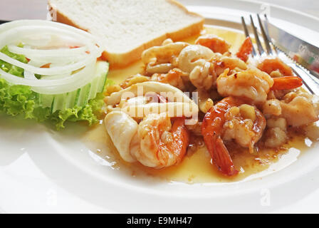 squid rings and shrimps on a plate Stock Photo