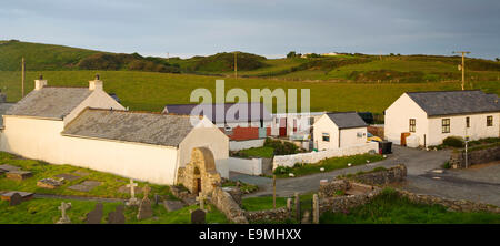 Holiday lets by St Patricks church on cliff top at Llanbadrig at the northern coast on Isle of Anglesey, North Wales UK Stock Photo