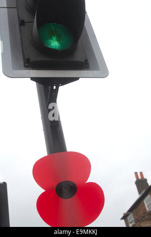 London, UK. 30th October, 2014.  Red Poppies decorate bus stops along the Wimbledon High street in preparation to Remembrance day commemorations Credit:  amer ghazzal/Alamy Live News Stock Photo