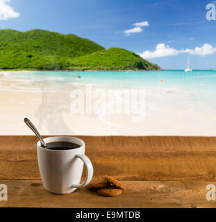 Morning cup of coffee on caribbean beach Stock Photo