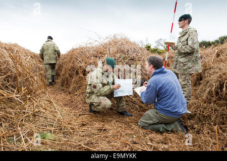 Soldiers help Richard Osgood, MOD Archaeologist to map overgrown trench ...