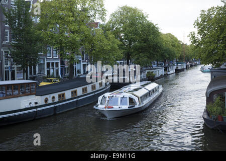 People literally live on the canals in Houseboats in Amsterdam, The Netherlands. Stock Photo