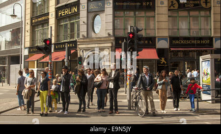 People waiting for light to change in the Mitte district, on Rosenthaler Street, Berlin. Stock Photo