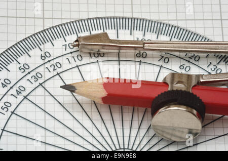 protractor and compass with  graph paper Stock Photo