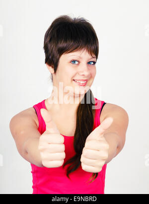 Girl with thumb up Stock Photo - Alamy